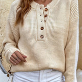 Beige knit pullover henley sweater with button-front placket and ribbed cuffs