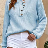 Light blue knit pullover henley sweater with button-front placket and long sleeves
