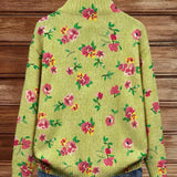 Back of floral knit cardigan in lime green with pink flower pattern