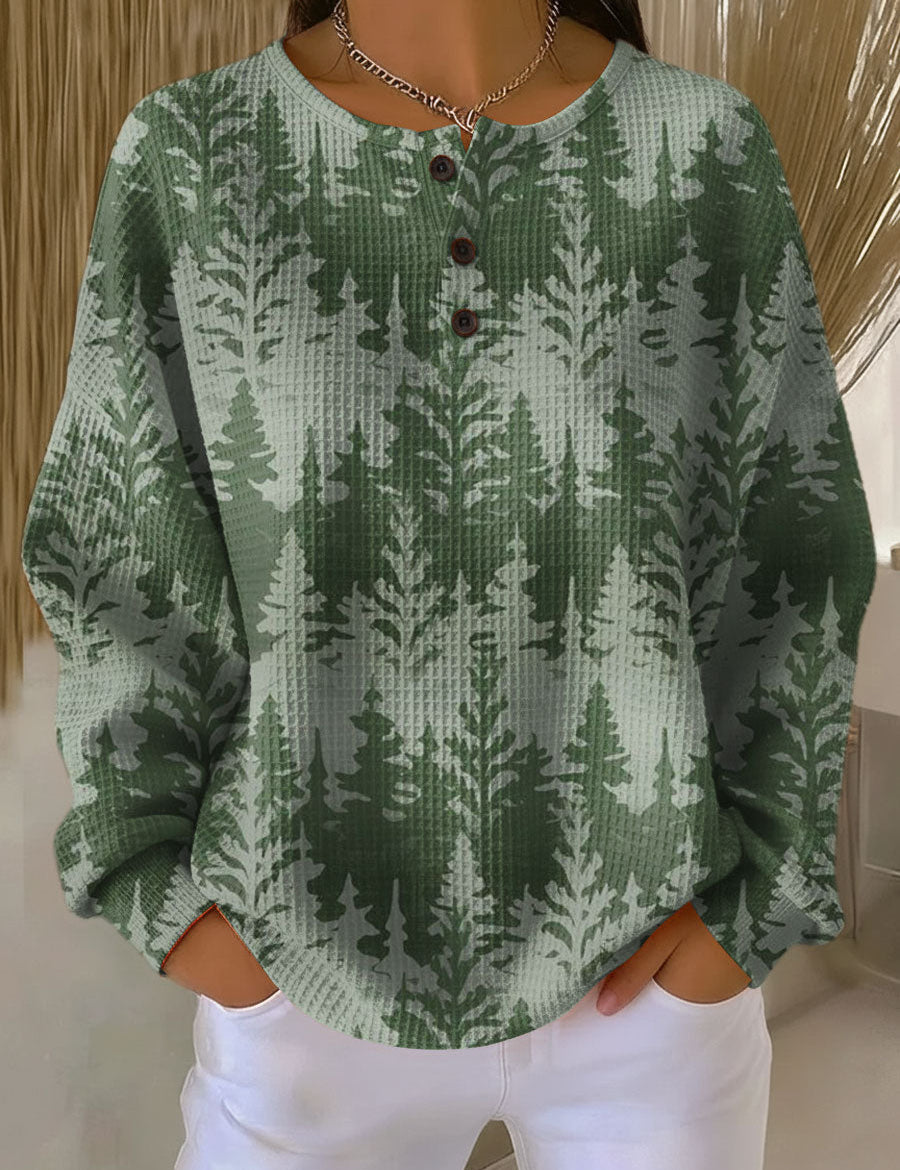 Green knit sweater with classic tree pattern and button-front henley neckline