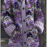 Knitted cat cardigan in lavender with purple floral pattern and button-front, long sleeves.