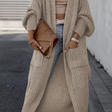 Brown long knit cardigan with open front, long sleeves, and side pockets