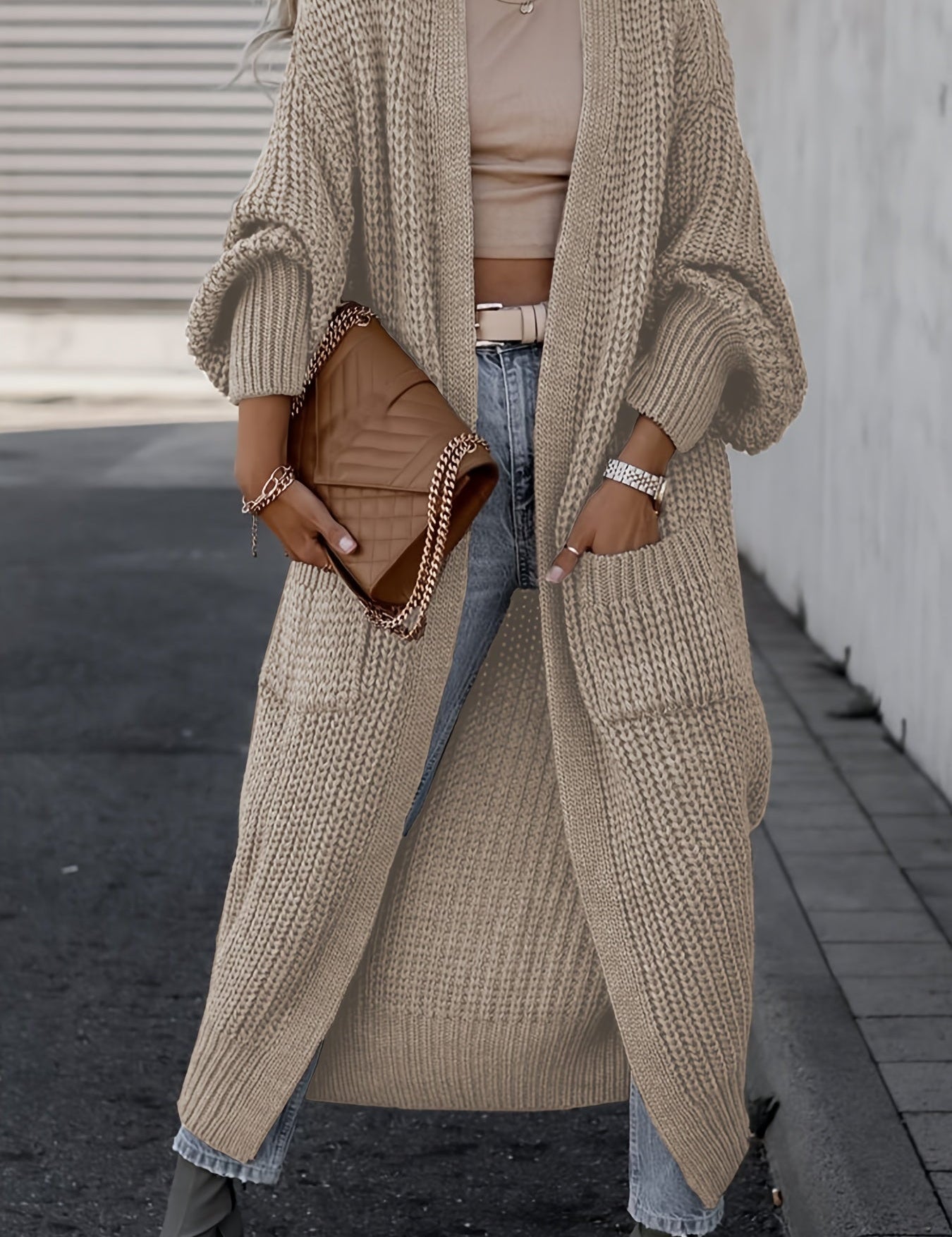 Brown long knit cardigan with open front, long sleeves, and side pockets