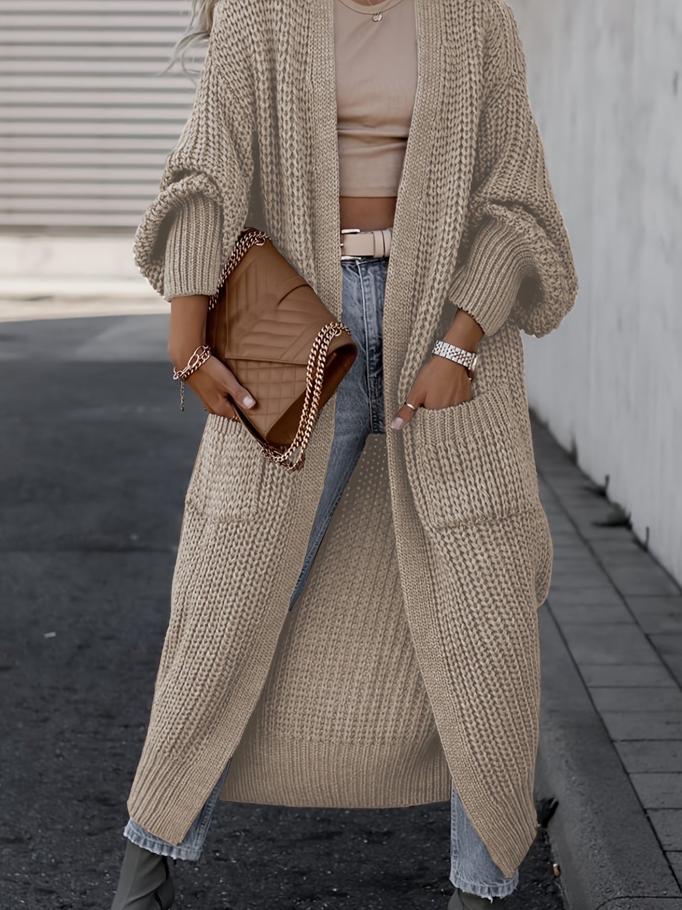 Brown long knit cardigan with open front, long sleeves, and side pockets
