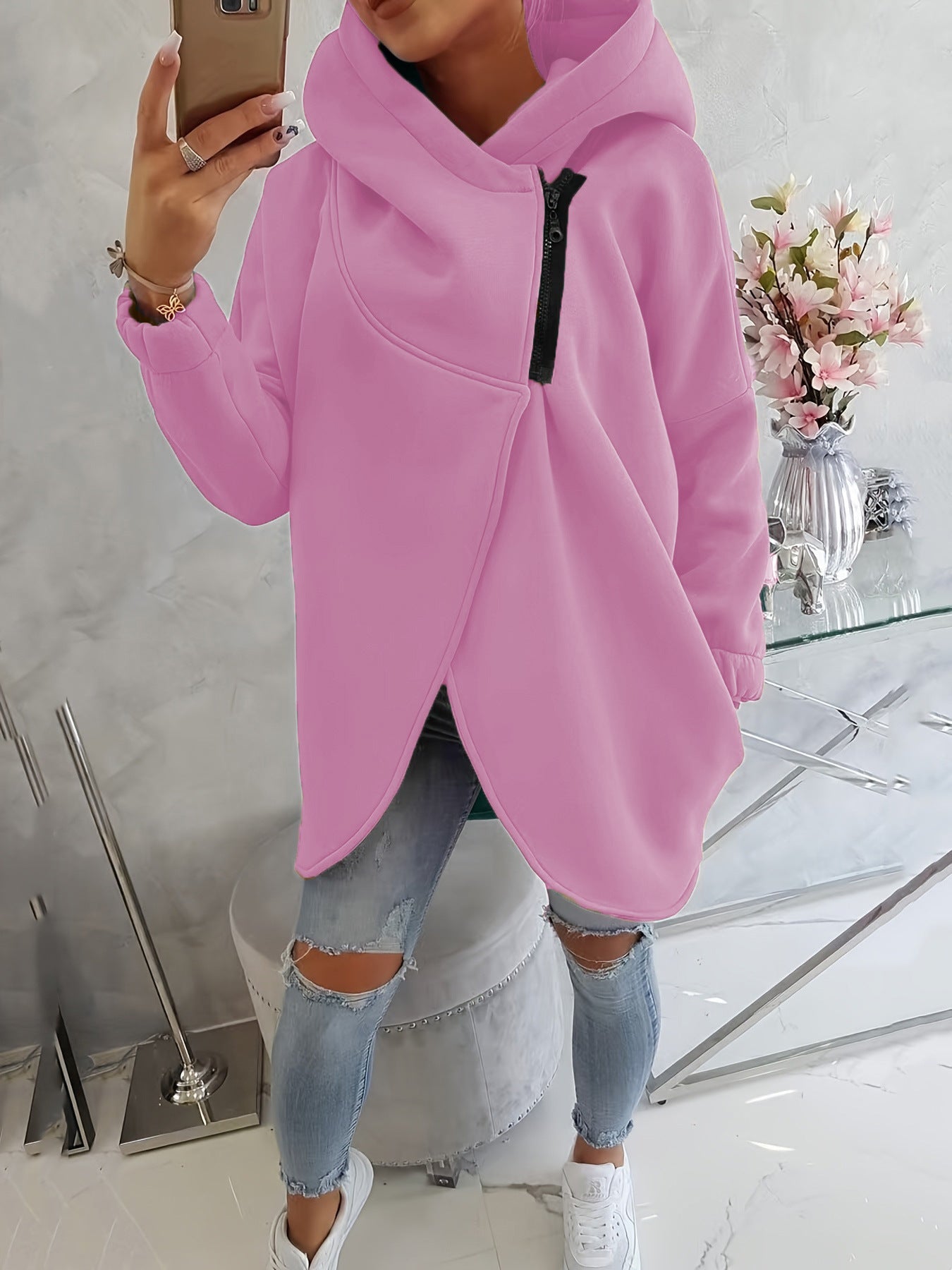 Pink zip-up hoodie with hood, front pocket, and black zipper trim