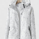 White hooded jacket with front zipper and stand collar, allover leaf pattern