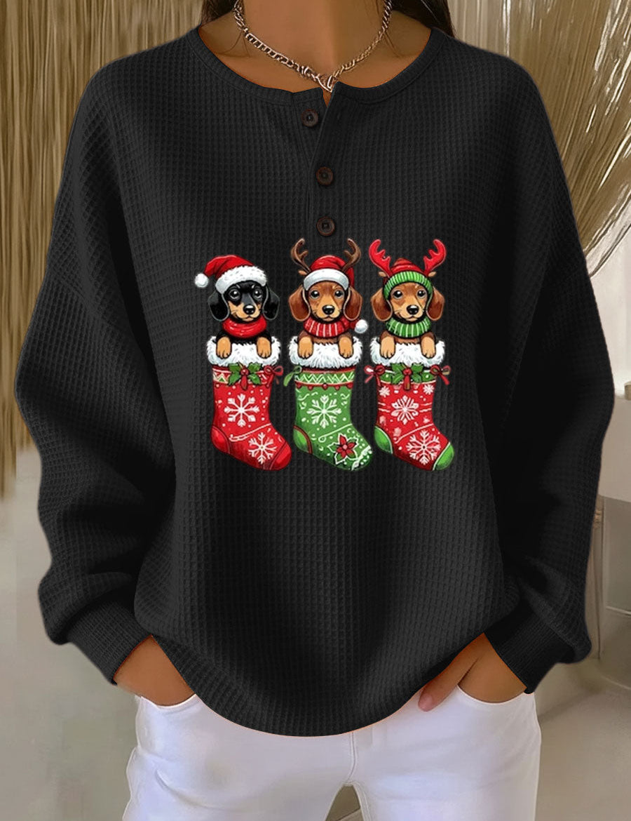 Black vintage Christmas henley sweater with dog motif and festive stockings graphic