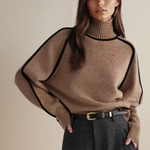 Brown knit pullover with high ribbed neck and black contrast trim on sleeves