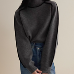 Dark gray turtleneck sweater with ribbed neckline and sleeve cuffs