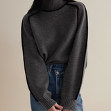 Dark gray turtleneck sweater with ribbed neckline and sleeve cuffs