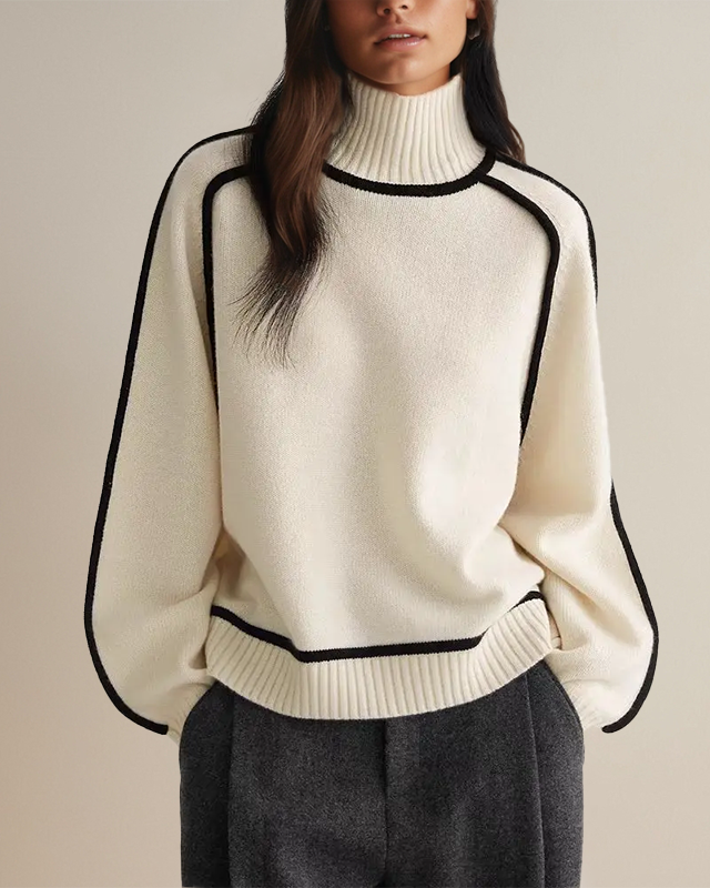 Off-white sweater with black trim, ribbed turtleneck and long sleeves