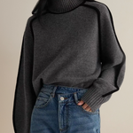 Dark gray turtleneck sweater with ribbed collar and cuffs, relaxed knit
