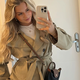 Women's khaki stand-collar jacket with double-breasted buttons and tied belt at waist