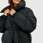 Black padded hooded jacket with wide cuffs, tie belt, snap button front.