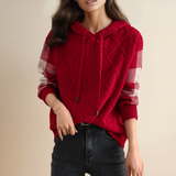 Hooded jacquard cable knit pullover with red body and white plaid sleeve panels