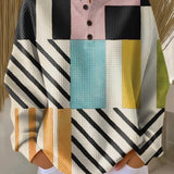 Colorblock pullover sweater with plaid and stripe panels, long sleeves, button placket