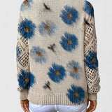 Floral knit pullover sweater back in cream with blue flower pattern and ribbed hem