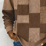 Brown patchwork hoodie front detail with hood, square panels and long sleeves