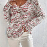 Loose knit pullover sweater with long sleeves, red-and-white speckled texture