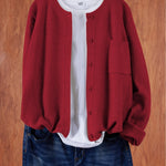 Red round-neck cardigan with button front and side pocket