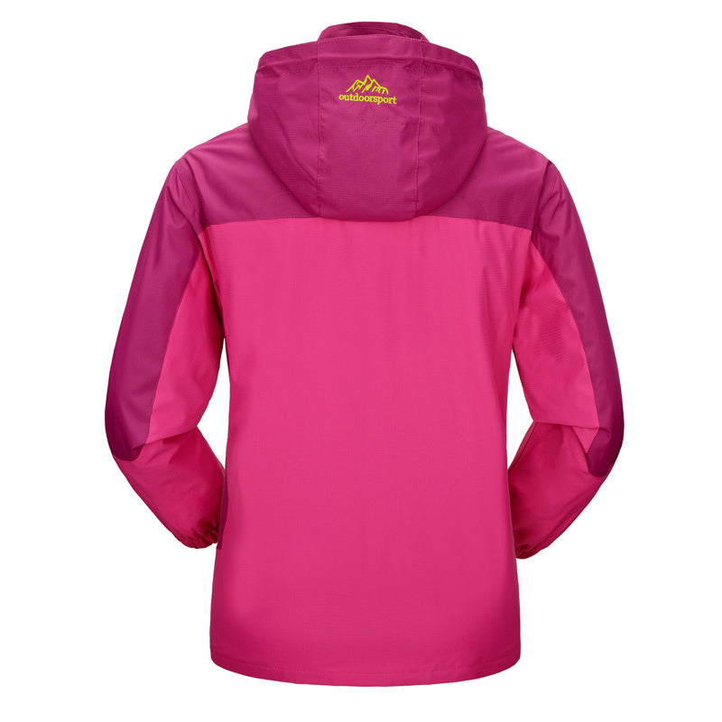 Women’s waterproof jacket in magenta with attached hood and full-length zip