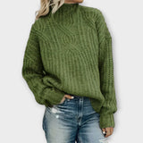Green cable-knit cozy sweater with mock neck and long sleeves