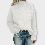 White cable-knit cozy sweater with mock neck and long sleeves