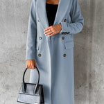 Light blue double-breasted overcoat with notch lapels, long sleeves, and decorative buttons