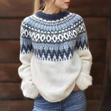 Fair isle knit sweater with cream lower section and navy geometric pattern on yoke.