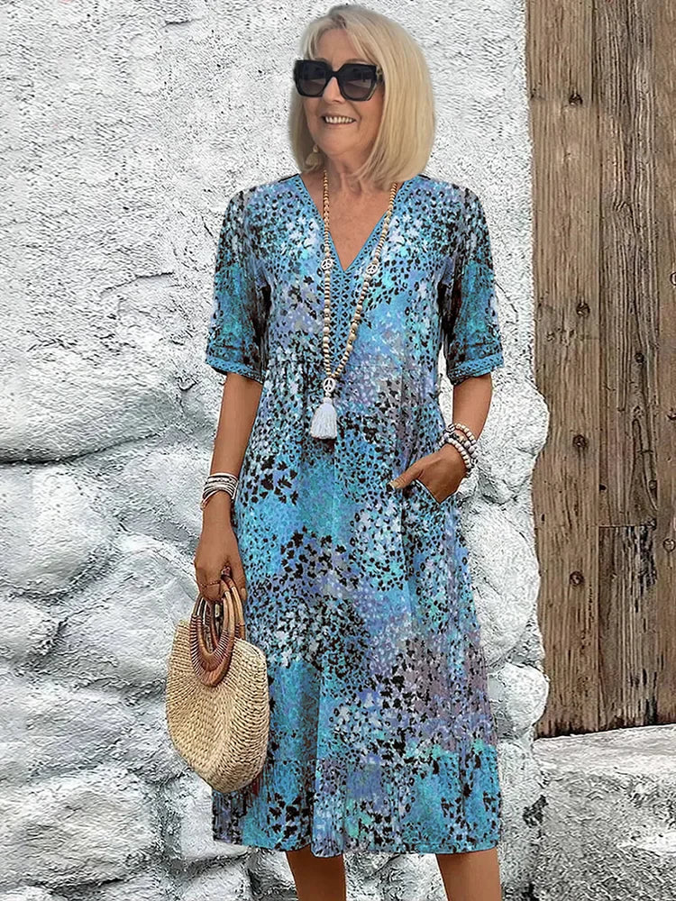 Monica elegant floral dress in blue, V-neck button front with tassel, short sleeves