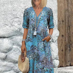 Monica elegant floral dress in blue, V-neck button front with tassel, short sleeves