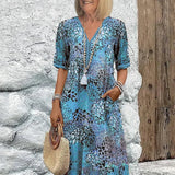 Monica elegant floral dress in blue, V-neck button front with tassel, short sleeves