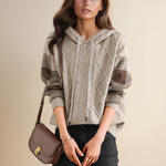 Hooded jacquard cable knit pullover in beige with brown plaid sleeve panels