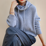 Light blue knit rollneck pullover with drawstring cowl collar and ribbed cuffs