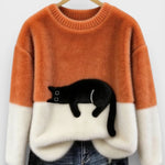 Orange and white two-tone sweatshirt with black cat graphic on the front
