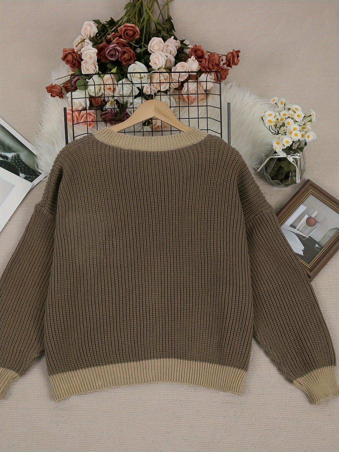 Back view dark brown knit cardigan with ribbed neckline, long sleeves, ribbed hem