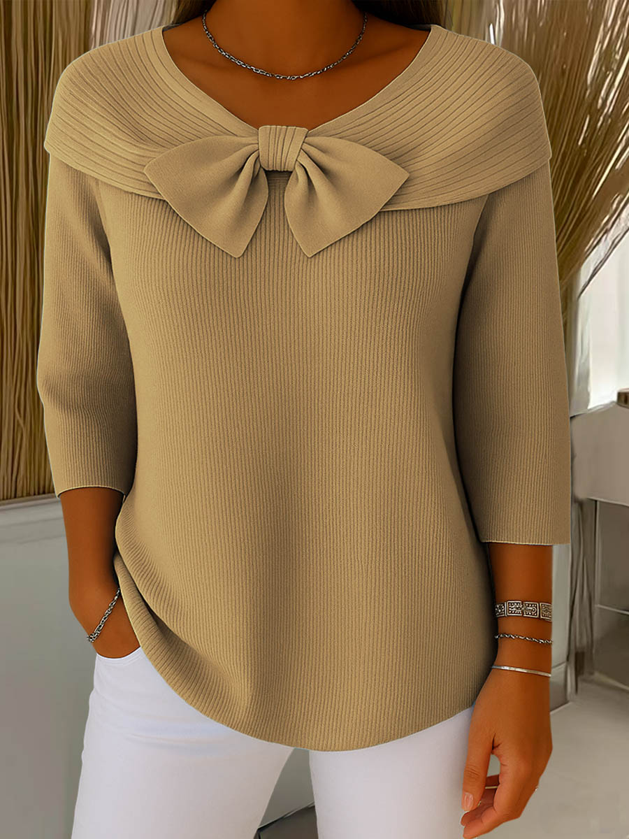 Tan ribbed knit sweater with large bow collar and 3/4 sleeves