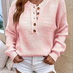 Pink knit pullover henley sweater with button-front placket and long sleeves