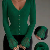 Green ribbed V-neck knit top with button front and lace cuff sleeves