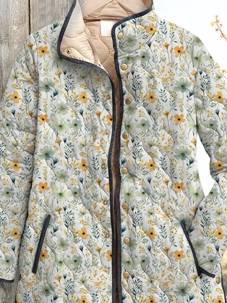 Women's quilted floral jacket, close view of zip front, floral buttons and collar