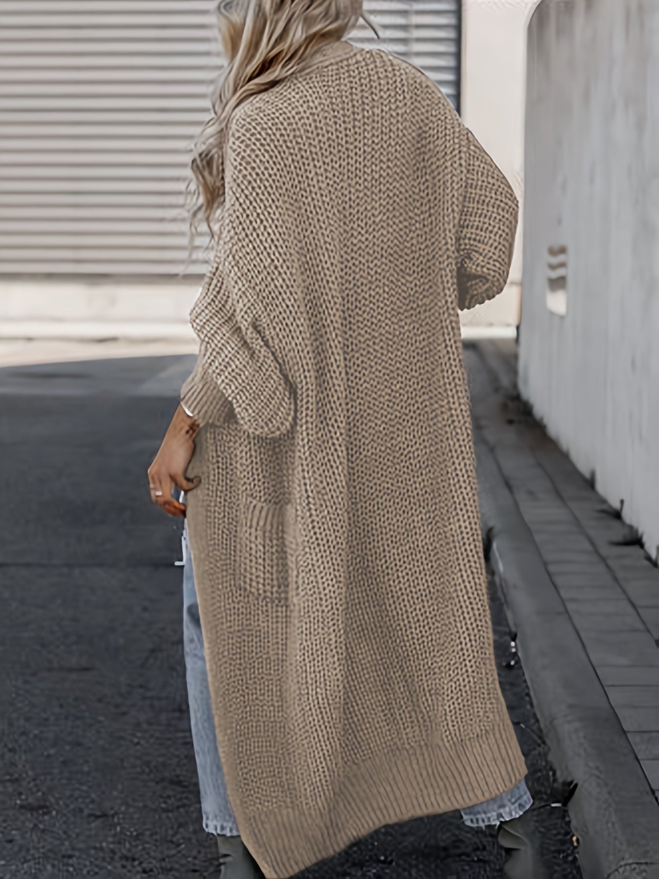 Beige long knit cardigan with open front, long sleeves, and side pockets