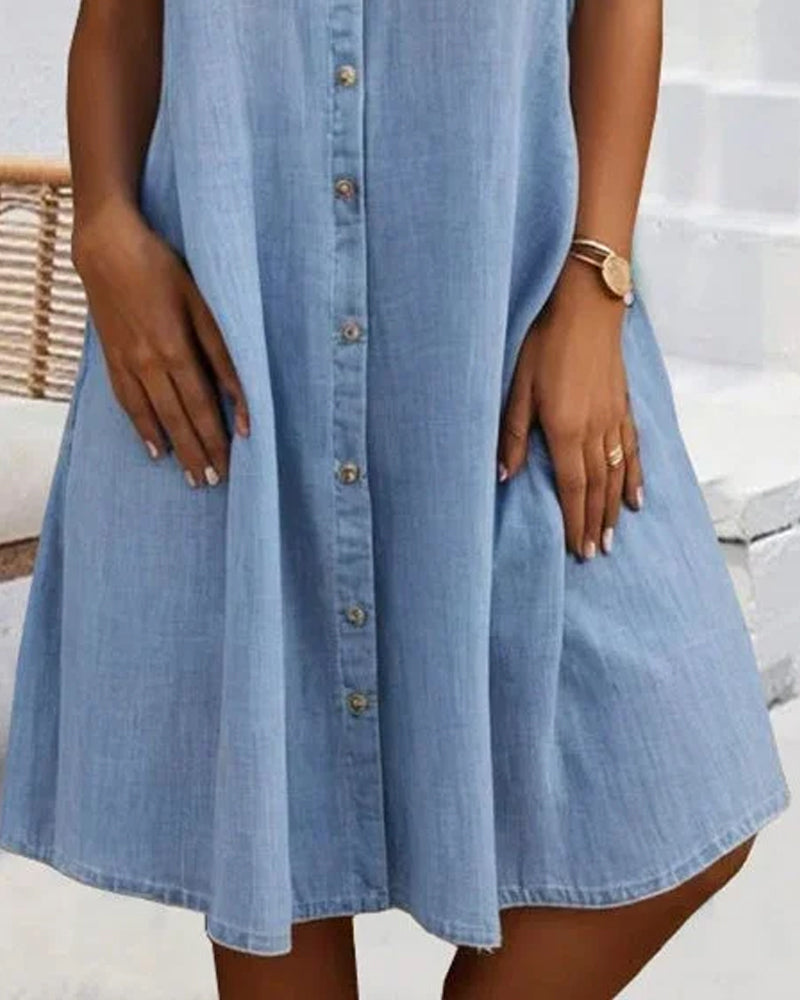 Light blue denim shirt dress with button front and flared skirt, knee-length