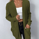 Women's long knit cardigan in green, open front with long sleeves and patch pockets