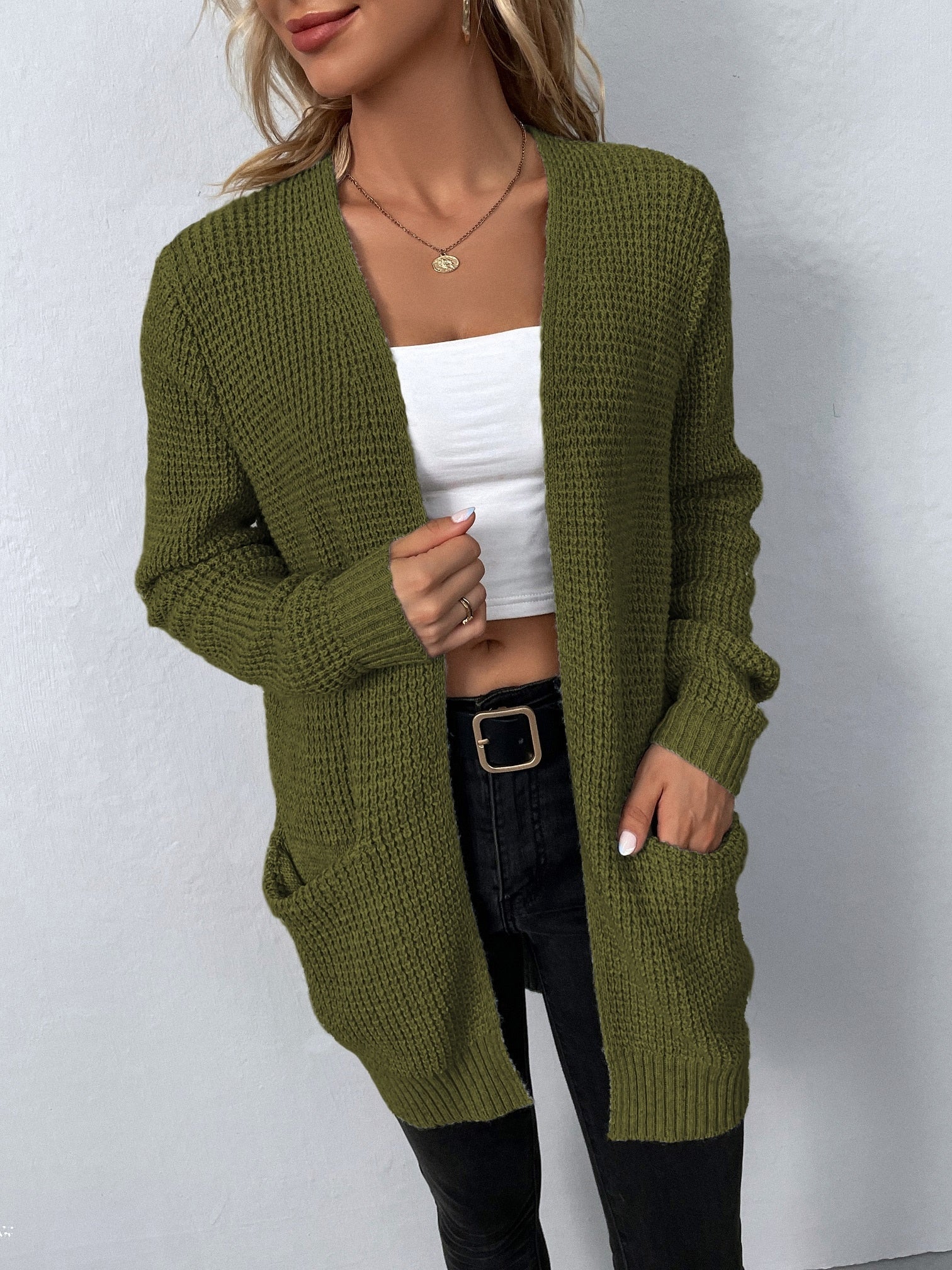 Women's long knit cardigan in green, open front with long sleeves and patch pockets