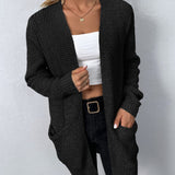 Black knit cardigan with open front and two patch pockets, long sleeves