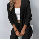 Black long knit cardigan with open front, ribbed cuffs, and two patch pockets
