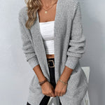 Long gray knit cardigan with open front, ribbed cuffs, and two patch pockets