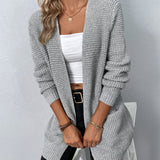 Long gray knit cardigan with open front, ribbed cuffs, and two patch pockets