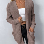 Mauve knit cardigan with open front and two patch pockets, long sleeves