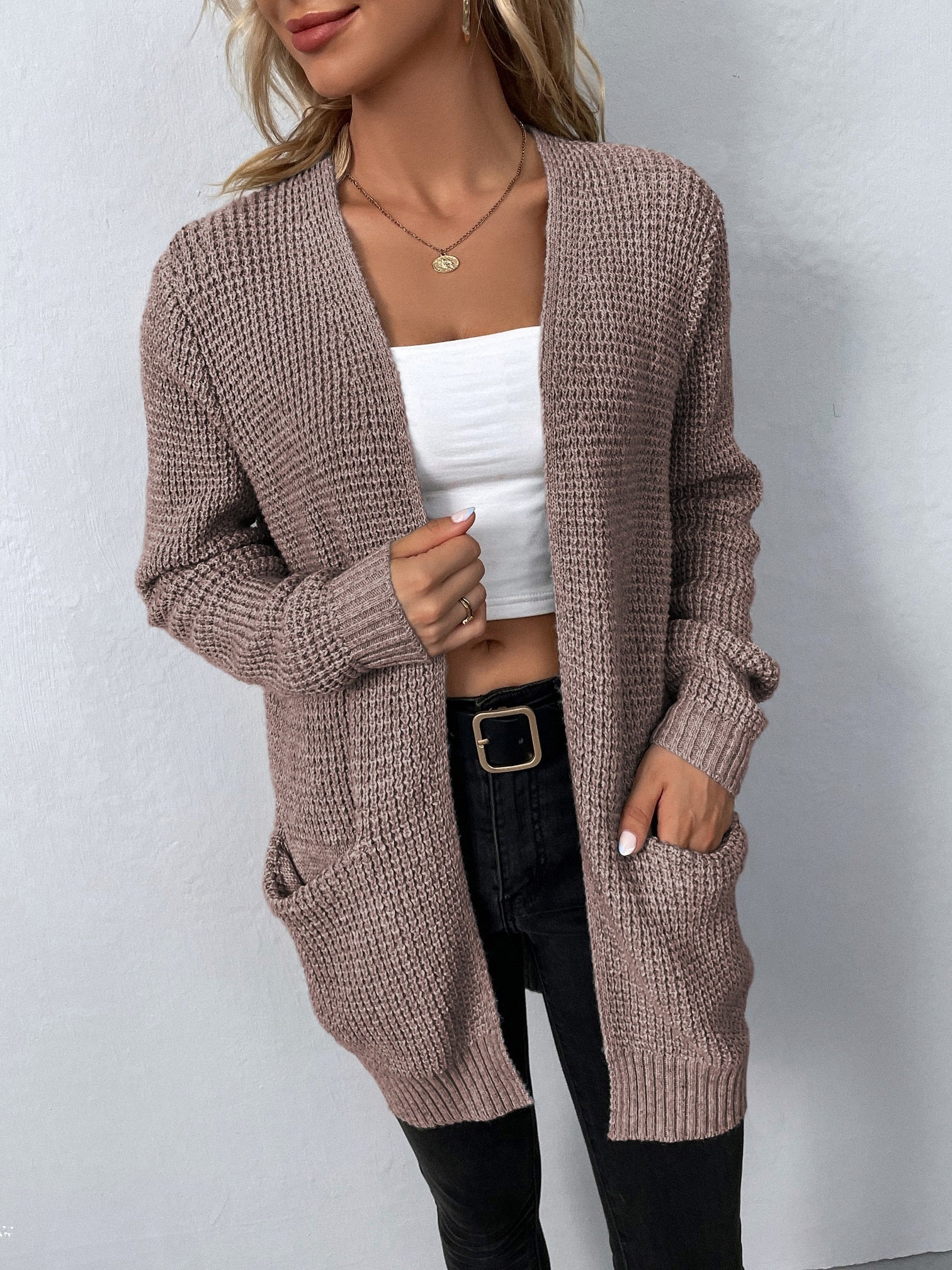 Mauve knit cardigan with open front and two patch pockets, long sleeves